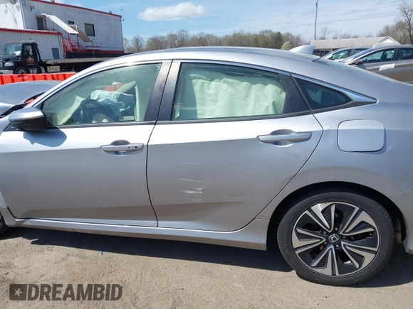 2018 Honda Civic EX-L with VIN JHMFC1F72JX043788, listed as a IAAI auction lot 41853131 with 137,266 mi miles and . Bid and sale history available at DreamBid. Image 14.