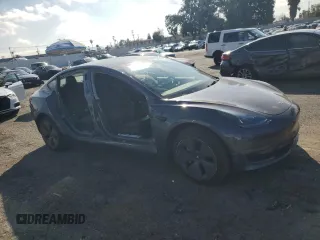 2023 Tesla Model 3 with VIN 5YJ3E1EA3PF541593, listed as a Copart auction lot 43926455 with 26,593 mi miles and Salvage title. Bid and sale history available at DreamBid. Image 4.