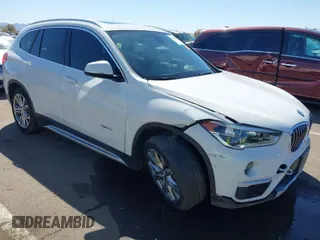 2017 BMW X1 xDrive28i with VIN WBXHT3C30H5F68187, listed as a IAAI auction lot 41830892 with 101,313 mi miles. Bid and sale history available at carsss.com. Image 1.