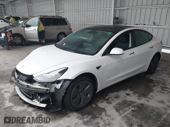 2023 Tesla Model 3 with VIN 5YJ3E1EA9PF548726, listed as a IAAI auction lot 42345157 with 30,647 mi miles and . Bid and sale history available at DreamBid. Image 2.