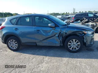 2016 Mazda CX-5 Sport with VIN JM3KE2BY8G0864983, listed as a IAAI auction lot 42072385 with 141,104 mi miles. Bid and sale history available at carsss.com. Image 13.