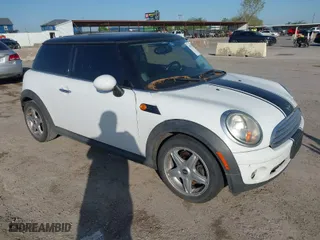 2009 MINI Cooper Hardtop with VIN WMWMF33569TZ20989, listed as a IAAI auction lot 41994772 with 152,944 mi miles. Bid and sale history available at carsss.com. Image 1.