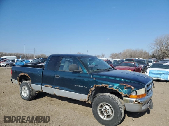 1997 Dodge Dakota z VIN 1B7GG23Y6VS264634, wystawiony jako Copart lot #50611355 z przebiegiem 221 823 mil mil oraz Szkoda całkowita • Salvage title. Historia ofert i sprzedaży dostępna na DreamBid. Obrazek 4.