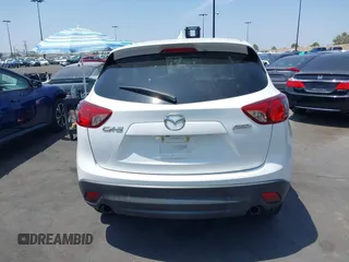 2016 Mazda CX-5 Grand Touring z VIN JM3KE2DY2G0824802, wystawiony jako IAAI lot #42170591 z przebiegiem 53 173 mil mil oraz . Historia ofert i sprzedaży dostępna na DreamBid. Obrazek 16.