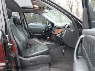 2001 Mercedes-Benz M-Class with VIN 4JGAB72E41A275216, listed as a IAAI auction lot 41953087 with 243,589 mi miles. Bid and sale history available at carsss.com. Image 5.
