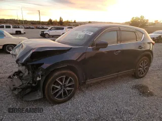 2018 Mazda CX-5 Grand Touring with VIN JM3KFBDM9J1326933, listed as a Copart auction lot 82180164 with 99,574 mi miles and Salvage title. Bid and sale history available at DreamBid. Image 1.