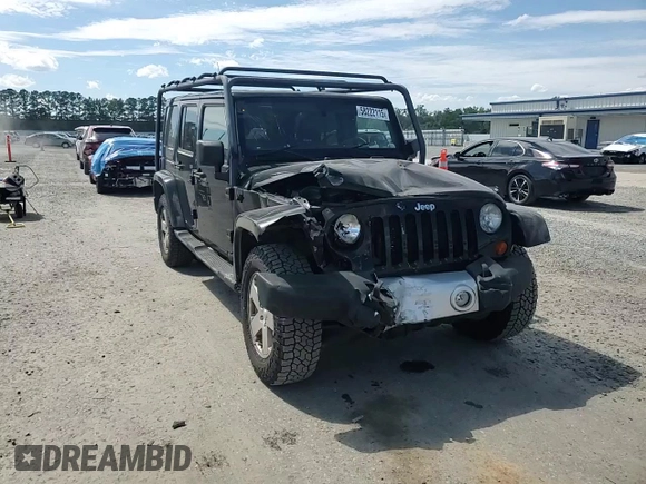 2012 Jeep Wrangler Unlimited Sahara with VIN 1C4HJWEG5CL205826, listed as a Copart auction lot 58222115 with 98,940 mi miles and Salvage title. Bid and sale history available at DreamBid. Image 14.