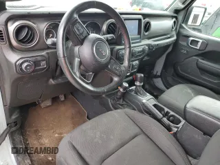2023 Jeep Wrangler Sport with VIN 1C4HJXAG0PW595881, listed as a Copart auction lot 65590025 with 19,597 mi miles and Salvage title. Bid and sale history available at DreamBid. Image 8.