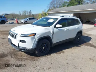2015 Jeep Cherokee Latitude with VIN 1C4PJMCS0FW790017, listed as a IAAI auction lot 42097988 with 105,990 mi miles and . Bid and sale history available at DreamBid. Image 2.