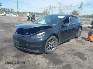 2023 Tesla Model 3 with VIN 5YJ3E1EA3PF681515, listed as a IAAI auction lot 41899053 with 15,985 mi miles and . Bid and sale history available at carsss.com. Image 2.