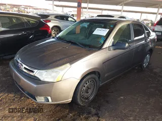 2011 Ford Focus S with VIN 1FAHP3EN7BW167384, listed as a IAAI auction lot 41687933 with 153,124 mi miles. Bid and sale history available at carsss.com. Image 2.
