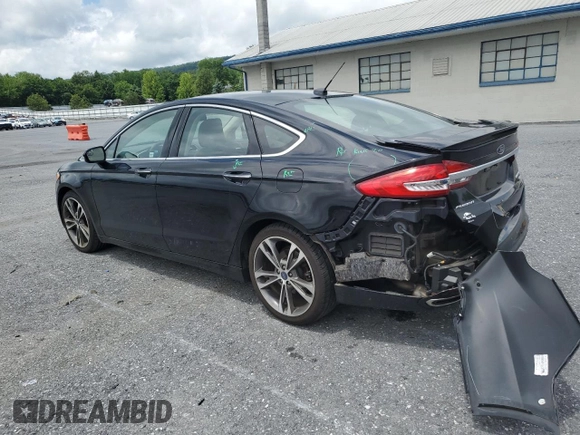 2017 Ford Fusion Titanium z VIN 3FA6P0K92HR192881, wystawiony jako Copart lot #61190515 z przebiegiem 109 834 mil mil oraz Szkoda całkowita • Salvage title. Historia ofert i sprzedaży dostępna na DreamBid. Obrazek 2.