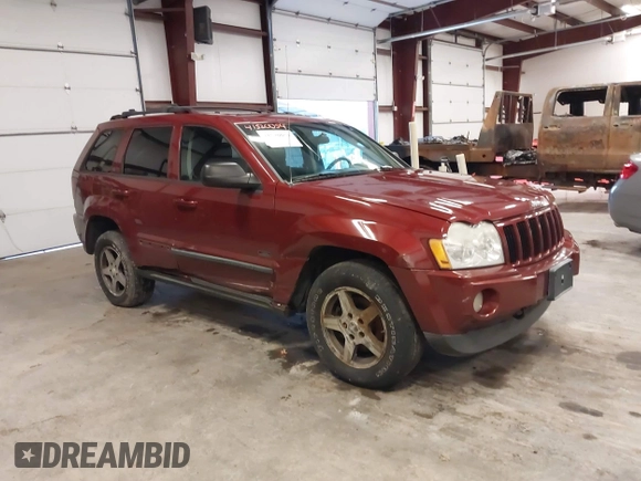 2007 Jeep Grand Cherokee Laredo with VIN 1J8GR48K97C631672, listed as a IAAI auction lot 41520054 with 231,576 mi miles. Bid and sale history available at carsss.com. Image 1.