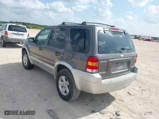 2005 Ford Escape Hybrid with VIN 1FMCU95H55KC07544, listed as a IAAI auction lot 42104756 with 250,109 mi miles. Bid and sale history available at carsss.com. Image 3.