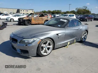 2011 BMW Z4 sDrive35i with VIN WBALM7C59BE384283, listed as a Copart auction lot 77204914 with 87,016 mi miles and Salvage Title. Bid and sale history available at carsss.com. Image 1.
