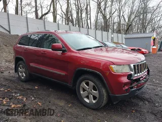 2012 Jeep Grand Cherokee Laredo with VIN 1C4RJFAG7CC123669, listed as a IAAI auction lot 42001472 with 164,806 mi miles. Bid and sale history available at carsss.com. Image 1.