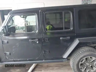 2021 Jeep Wrangler Unlimited Rubicon with VIN 1C4HJXFN2MW587168, listed as a IAAI auction lot 42472309 with 66,272 mi miles and . Bid and sale history available at DreamBid. Image 14.