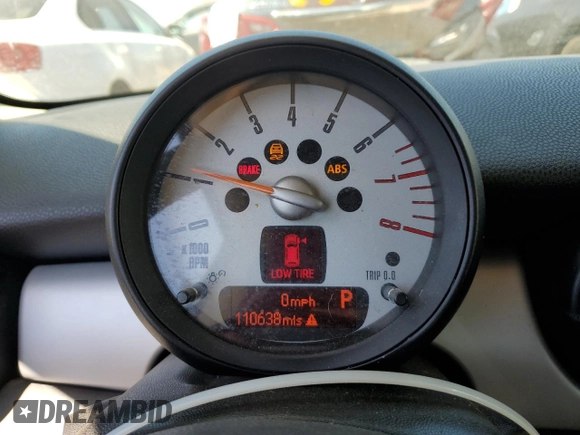 2012 MINI Hardtop with VIN WMWSU3C5XCT261853, listed as a Copart auction lot 49980285 with 110,638 mi miles and Salvage Title. Bid and sale history available at DreamBid. Image 9.