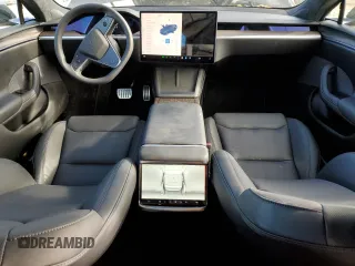 2023 Tesla Model S with VIN 5YJSA1E57PF507456, listed as a Copart auction lot 44649945 with 8,760 mi miles and Salvage title. Bid and sale history available at DreamBid. Image 8.