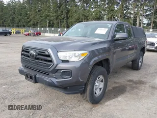 2018 Toyota Tacoma SR z VIN 5TFSX5EN0JX062612, wystawiony jako IAAI lot #41993211 z przebiegiem 92 586 mil mil oraz . Historia ofert i sprzedaży dostępna na DreamBid. Obrazek 2.