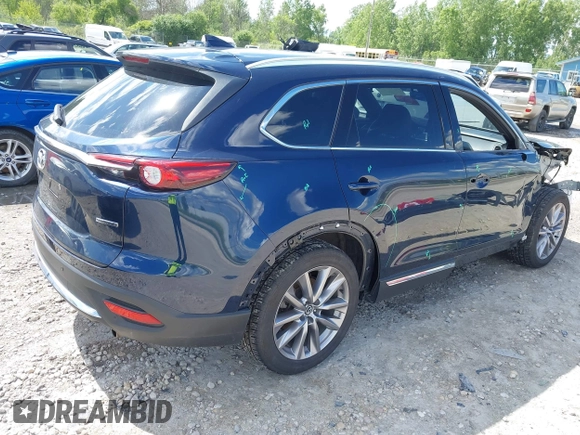 2021 Mazda CX-9 Grand Touring with VIN JM3TCBDY4M0513099, listed as a IAAI auction lot 42563530 with 76,006 mi miles and . Bid and sale history available at DreamBid. Image 4.