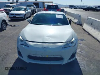 2015 Scion FR-S with VIN JF1ZNAA12F9709707, listed as a IAAI auction lot 41545940 with 107,575 mi miles. Bid and sale history available at carsss.com. Image 12.
