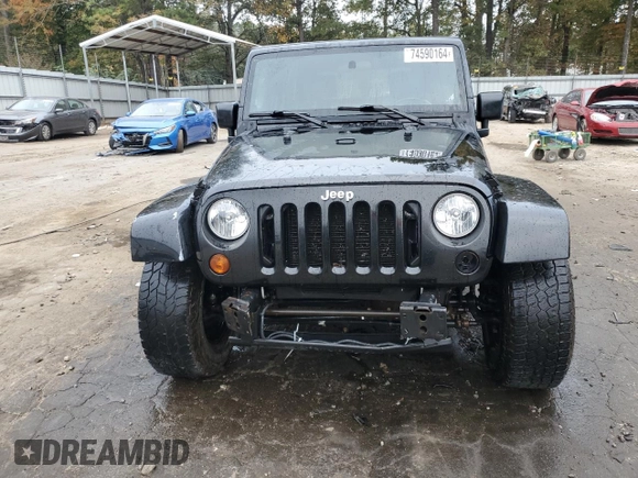 2008 Jeep Wrangler Unlimited Sahara with VIN 1J4GA59148L574934, listed as a Copart auction lot 74590164 with 134,674 mi miles and Salvage title. Bid and sale history available at DreamBid. Image 5.