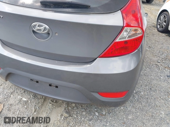 2014 Hyundai Accent GS with VIN KMHCT5AE3EU141605, listed as a IAAI auction lot 42157550 with 174,197 mi miles. Bid and sale history available at carsss.com. Image 6.