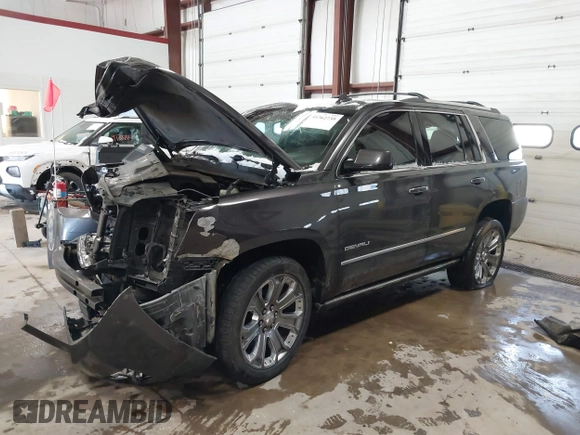 2016 GMC Yukon Denali with VIN 1GKS2CKJ8GR215954, listed as a IAAI auction lot 41362739 with 143,982 mi miles. Bid and sale history available at carsss.com. Image 16.