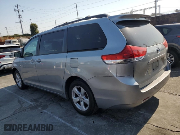 2011 Toyota Sienna LE AAS with VIN 5TDKK3DC6BS054847, listed as a Copart auction lot 64673975 with 197,266 mi miles and Salvage title. Bid and sale history available at DreamBid. Image 2.