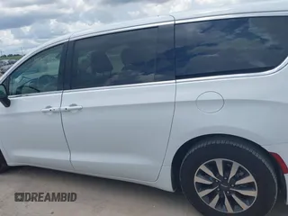 2023 Chrysler Pacifica Hybrid Touring L with VIN 2C4RC1L71PR622474, listed as a IAAI auction lot 42595061 with 55,880 mi miles and . Bid and sale history available at DreamBid. Image 14.