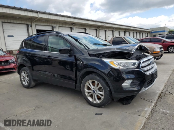 2017 Ford Escape SE z VIN 1FMCU0G93HUF10560, wystawiony jako Copart lot #57973915 z przebiegiem 127 444 mil mil oraz Czysty tytuł • Clean title. Historia ofert i sprzedaży dostępna na DreamBid. Obrazek 4.