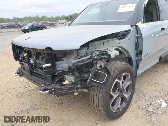 2023 Rivian R1T Adventure z VIN 7FCTGBAA6PN028520, wystawiony jako IAAI lot #42117498 z przebiegiem 24 583 mil mil oraz . Historia ofert i sprzedaży dostępna na DreamBid. Obrazek 6.