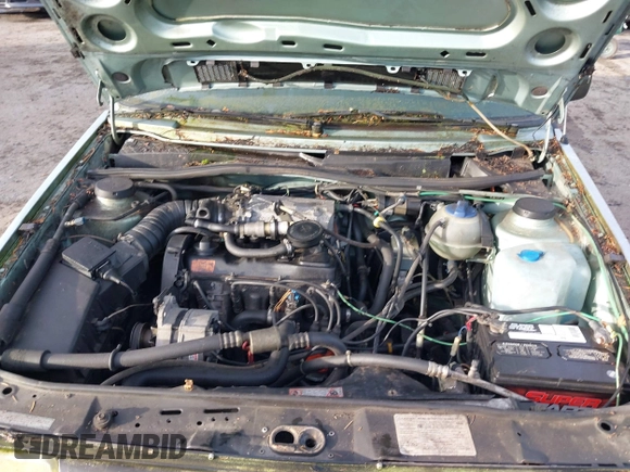1991 Volkswagen Jetta z VIN 3VWRB21G1MM017401, wystawiony jako IAAI lot #41018295 z przebiegiem 206 316 mil mil oraz . Historia ofert i sprzedaży dostępna na DreamBid. Obrazek 10.