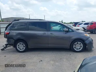 2015 Toyota Sienna XLE with VIN 5TDYK3DCXFS688971, listed as a IAAI auction lot 42127912 with 143,024 mi miles. Bid and sale history available at carsss.com. Image 13.
