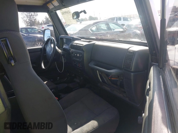 2004 Jeep Wrangler Rubicon with VIN 1J4FA69S94P701660, listed as a IAAI auction lot 41699554 with 74,640 mi miles. Bid and sale history available at carsss.com. Image 5.