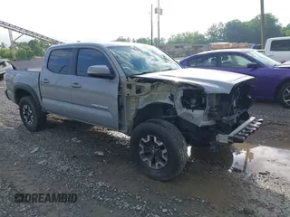 2021 Toyota Tacoma SR with VIN 5TFCZ5AN7MX255512, listed as a IAAI auction lot 42497907 with 50,563 mi miles and . Bid and sale history available at DreamBid. Image 1.