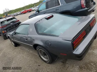 1986 Pontiac Firebird with VIN 1G2FS87S2GL247754, listed as a Copart auction lot 49340634 with 52,081 mi miles and Salvage Title. Bid and sale history available at carsss.com. Image 2.