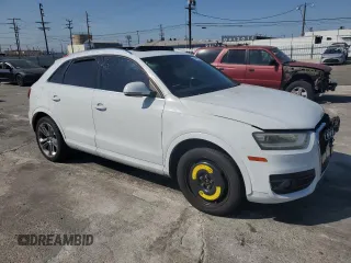 2015 Audi Q3 Prestige with VIN WA1FFCFS5FR008970, listed as a Copart auction lot 63481644 with 103,795 mi miles and Salvage title. Bid and sale history available at DreamBid. Image 4.