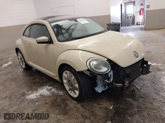 2019 Volkswagen Beetle S with VIN 3VWFD7ATXKM705322, listed as a IAAI auction lot 41409600 with 97,479 mi miles. Bid and sale history available at carsss.com. Image 1.
