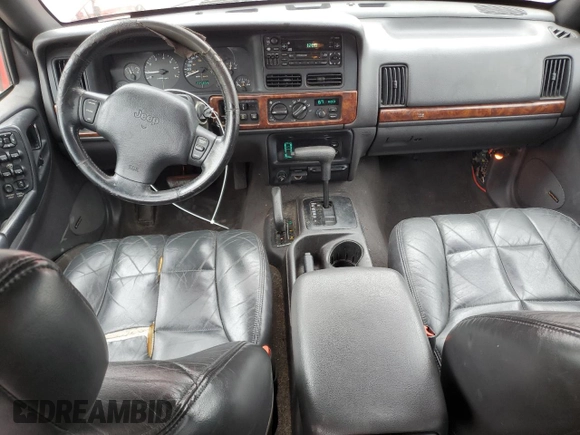 1998 Jeep Grand Cherokee Limited z VIN 1J4GZ78S0WC276411, wystawiony jako Copart lot #78200114 z przebiegiem 220 856 mil mil oraz Szkoda całkowita • Salvage title. Historia ofert i sprzedaży dostępna na DreamBid. Obrazek 8.