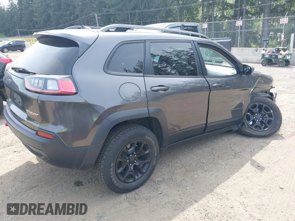 2019 Jeep Cherokee Trailhawk with VIN 1C4PJMBX2KD231734, listed as a IAAI auction lot 42235469 with 104,565 mi miles and . Bid and sale history available at DreamBid. Image 4.