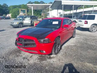 2013 Dodge Charger SXT with VIN 2C3CDXHGXDH742942, listed as a IAAI auction lot 42025564 with 292,681 mi miles. Bid and sale history available at carsss.com. Image 2.