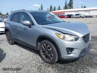 2016 Mazda CX-5 Grand Touring with VIN JM3KE4DYXG0647802, listed as a IAAI auction lot 41996854 with 85,774 mi miles. Bid and sale history available at carsss.com. Image 1.