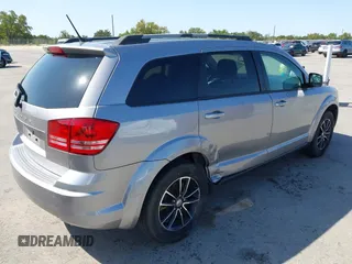 2017 Dodge Journey SE z VIN 3C4PDCAB1HT573511, wystawiony jako IAAI lot #41984865 z przebiegiem 128 721 mil mil oraz . Historia ofert i sprzedaży dostępna na DreamBid. Obrazek 4.