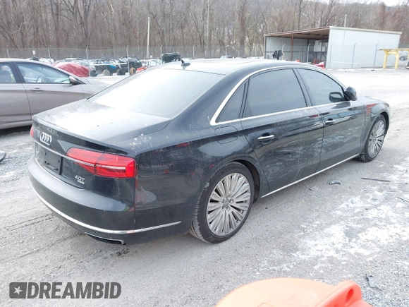 2015 Audi A8 L 4.0T with VIN WAU32AFD7FN006233, listed as a IAAI auction lot 41353034 with 119,693 mi miles. Bid and sale history available at carsss.com. Image 4.