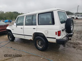 1990 Mitsubishi Montero z VIN JA4GJ31S2LJ003083, wystawiony jako Copart lot #73539314 z przebiegiem 115 191 mil mil oraz Nie do naprawy • Non repairable. Historia ofert i sprzedaży dostępna na DreamBid. Obrazek 2.