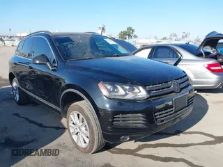 2013 Volkswagen Touareg Lux with VIN WVGEF9BPXDD001489, listed as a IAAI auction lot 42643445 with 96,508 mi miles and . Bid and sale history available at DreamBid. Image 1.