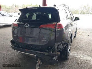 2016 Toyota RAV4 SE with VIN JTMJFREV7GJ072488, listed as a IAAI auction lot 42031254 with 106,901 mi miles. Bid and sale history available at carsss.com. Image 6.