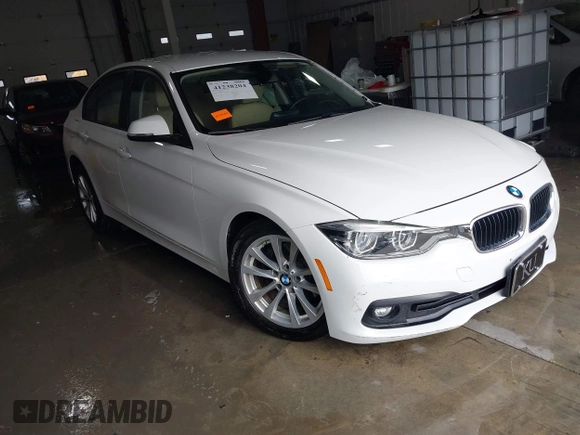 2018 BMW 3 Series 320i xDrive with VIN WBA8E5G56JNU47338, listed as a IAAI auction lot 41238204 with 54,596 mi miles. Bid and sale history available at carsss.com. Image 1.